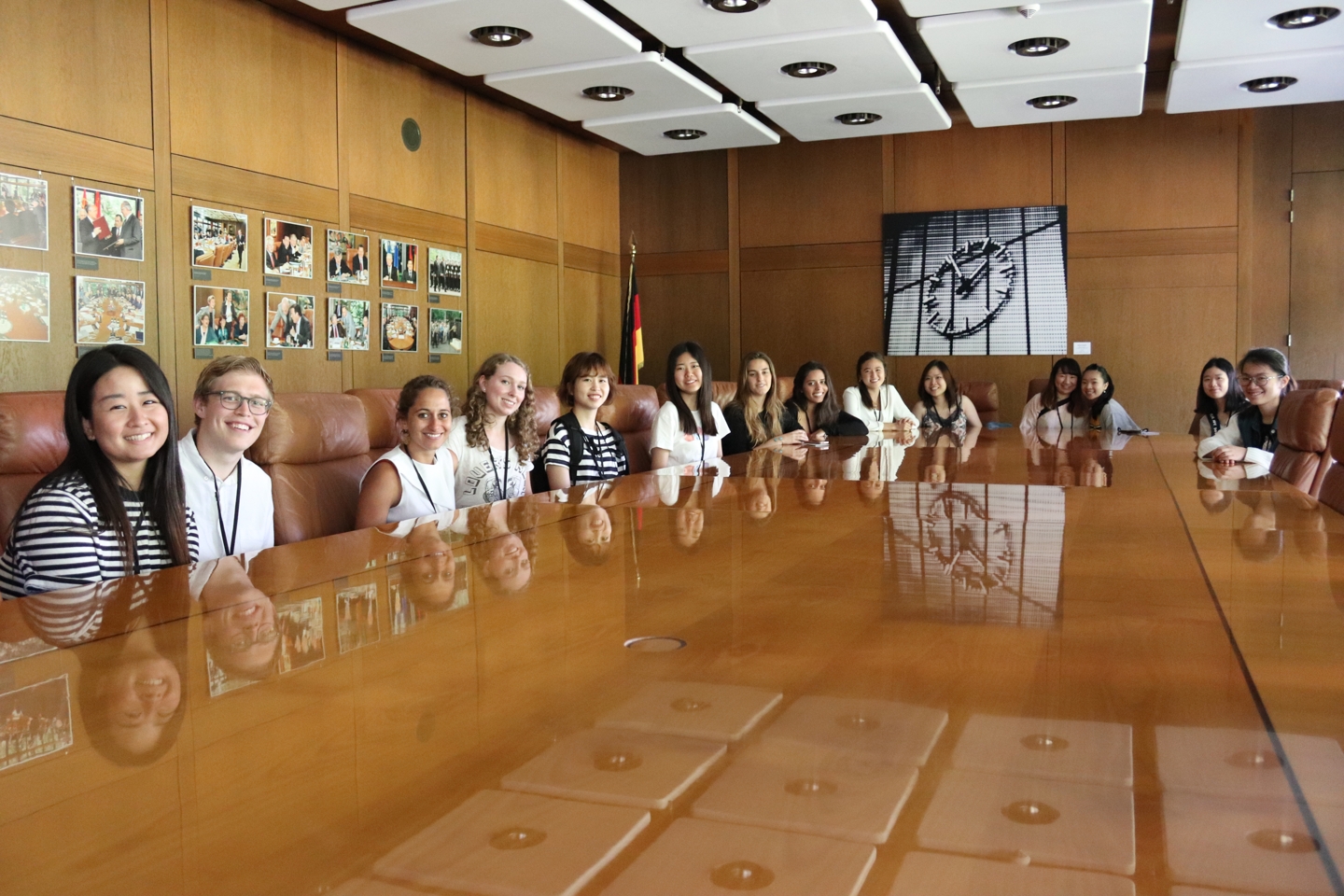 Group of students sitting at a big conference table